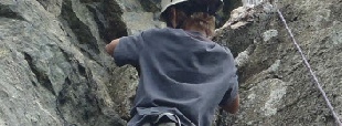 Climbing a steep groove Langdale
